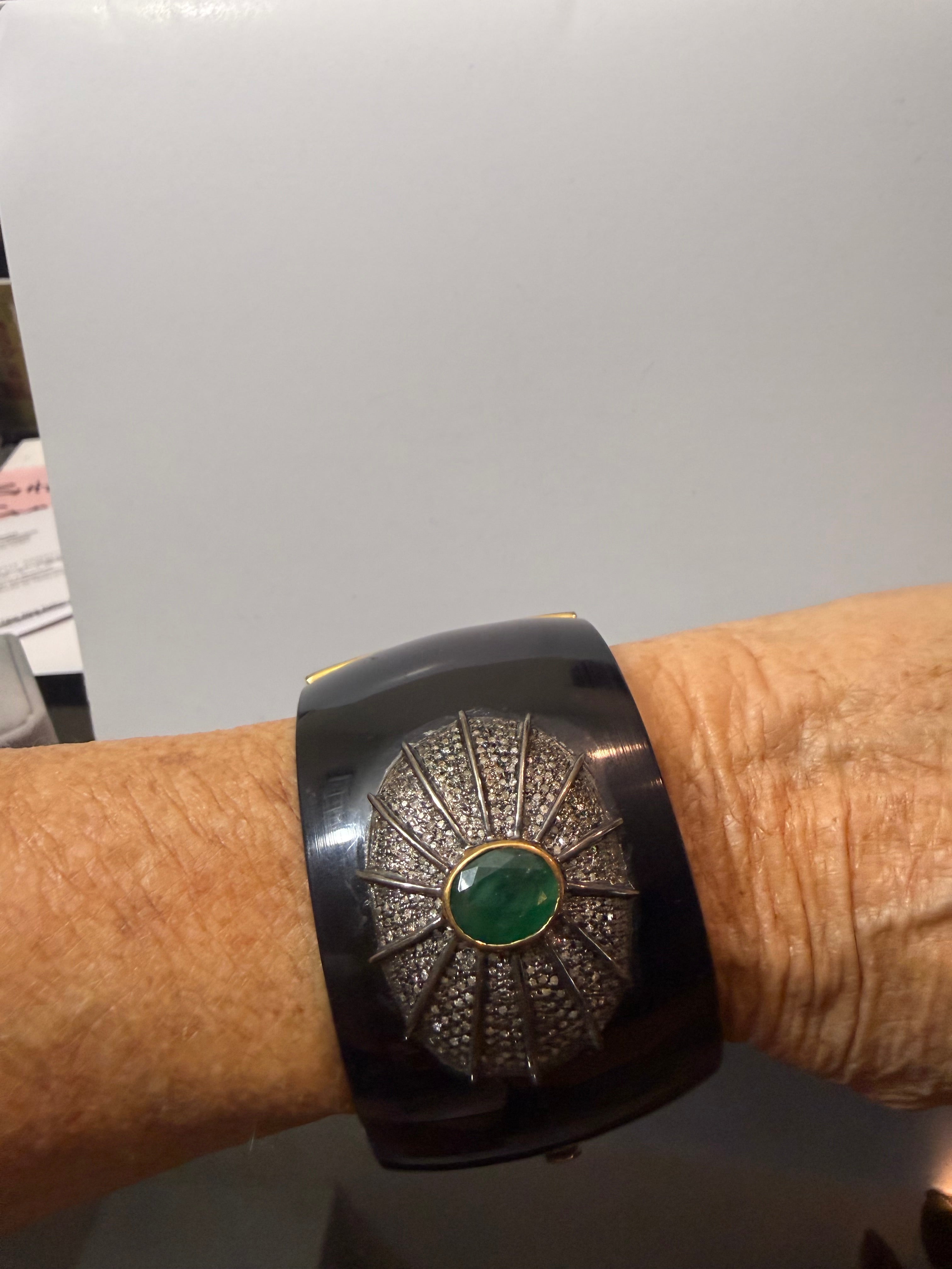 Eddie and Diamond, surrounding emerald set into a Horn cuff