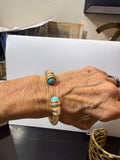 brushed gold bangle with turquoise stone