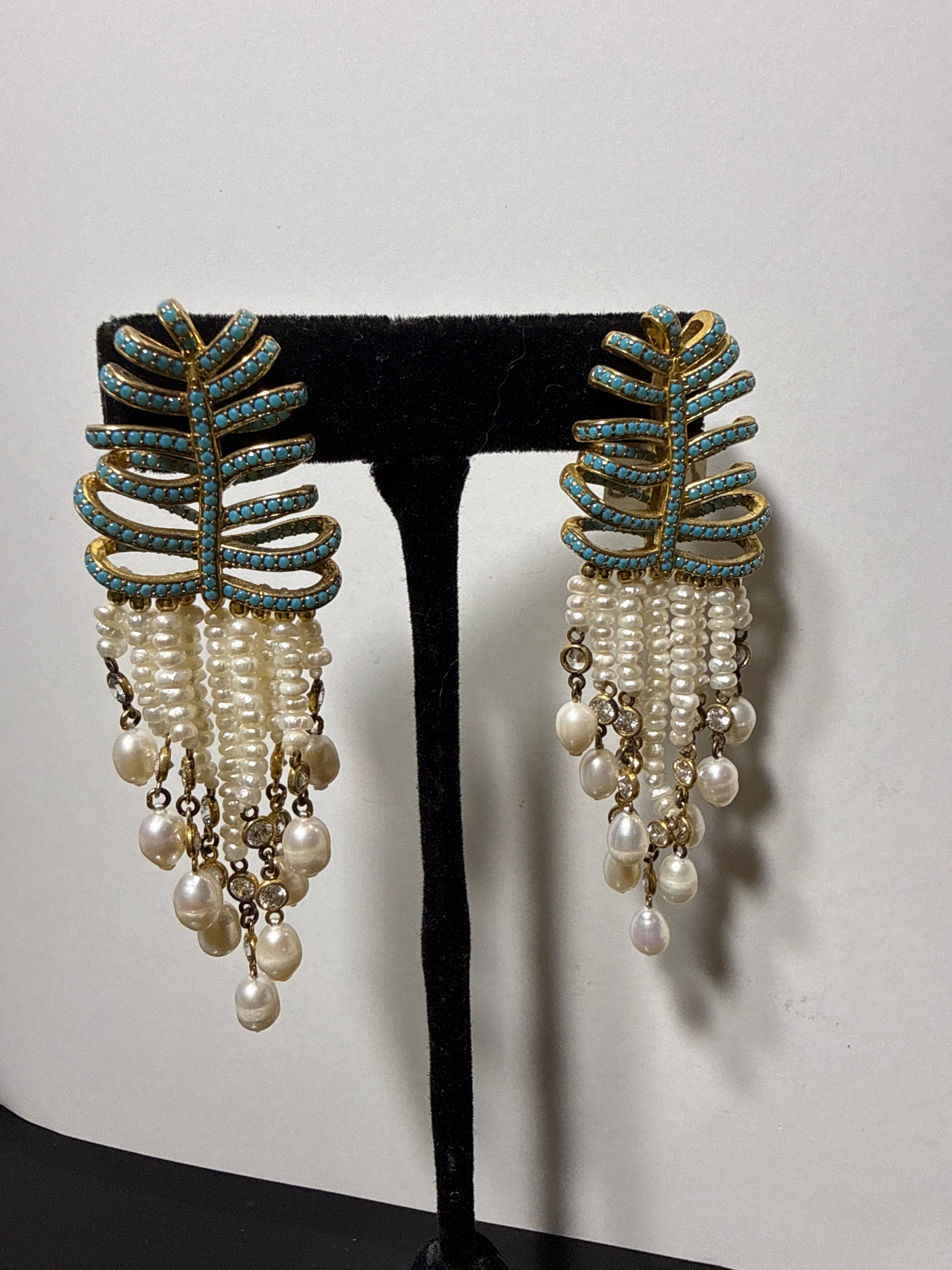 turquoise palms dripping with tiny pearls