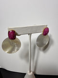 pink stones with mother-of-pearl disc