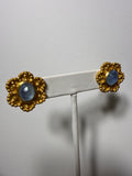 Gold flower disc with blue stones