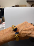 Gold bangle with black Onyx stones