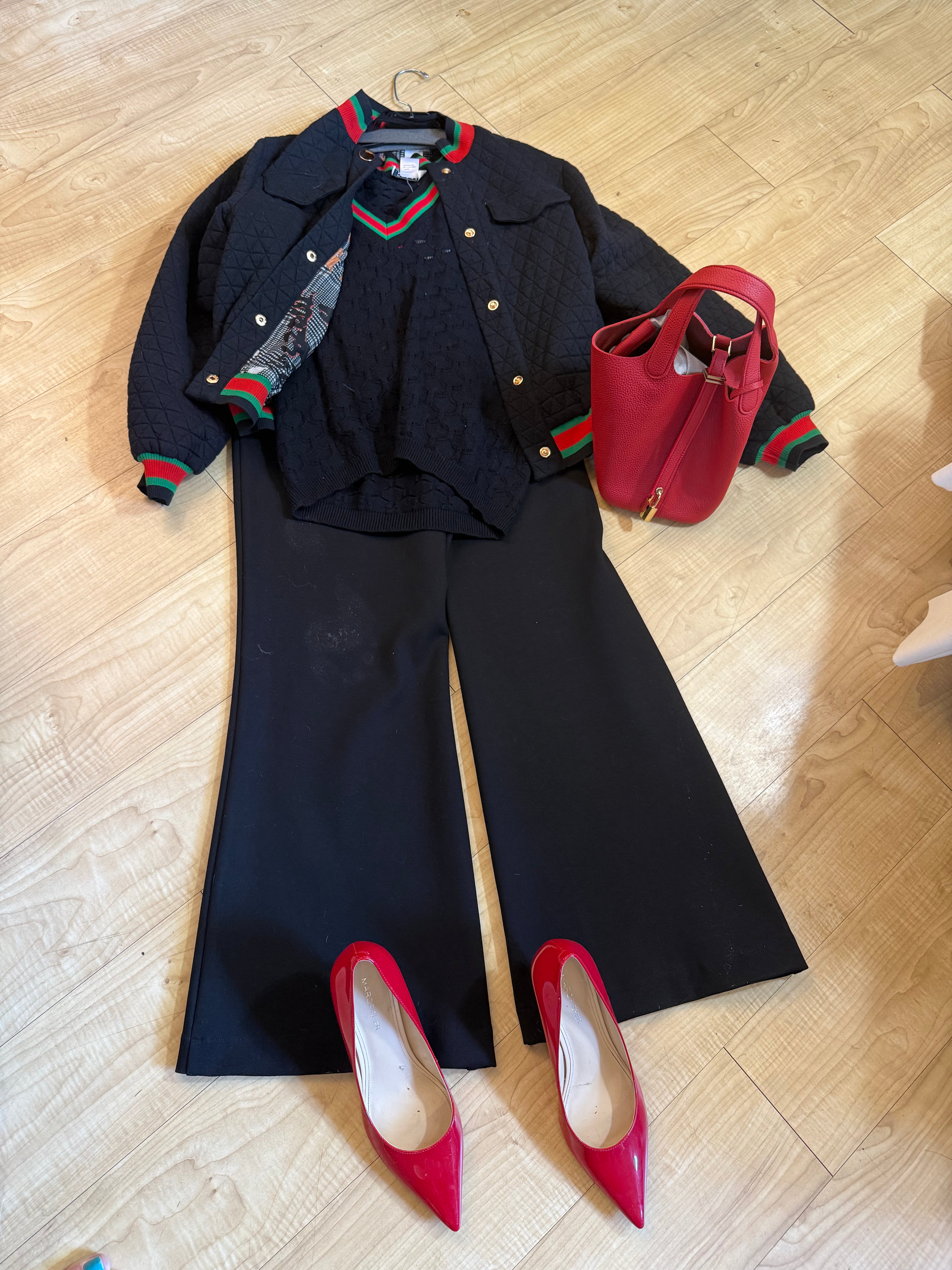 Black sweater with red and green trim